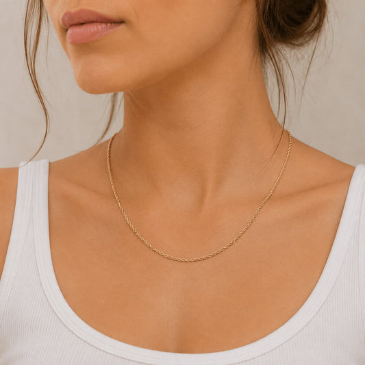 1.4mm rope chain in 9ct yellow gold worn around the neck