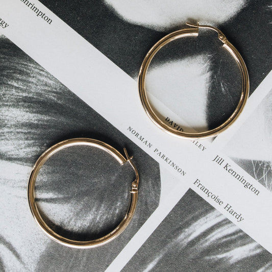 Classic Hoops shown side by side highlighting their polished gold finish
