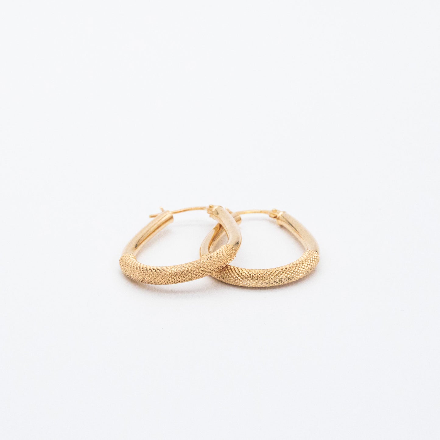 Set of hollow oval-shaped 9ct gold hoop earrings