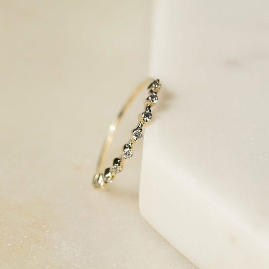 Spotted stacker ring with nine white diamonds on a thin 9ct gold band