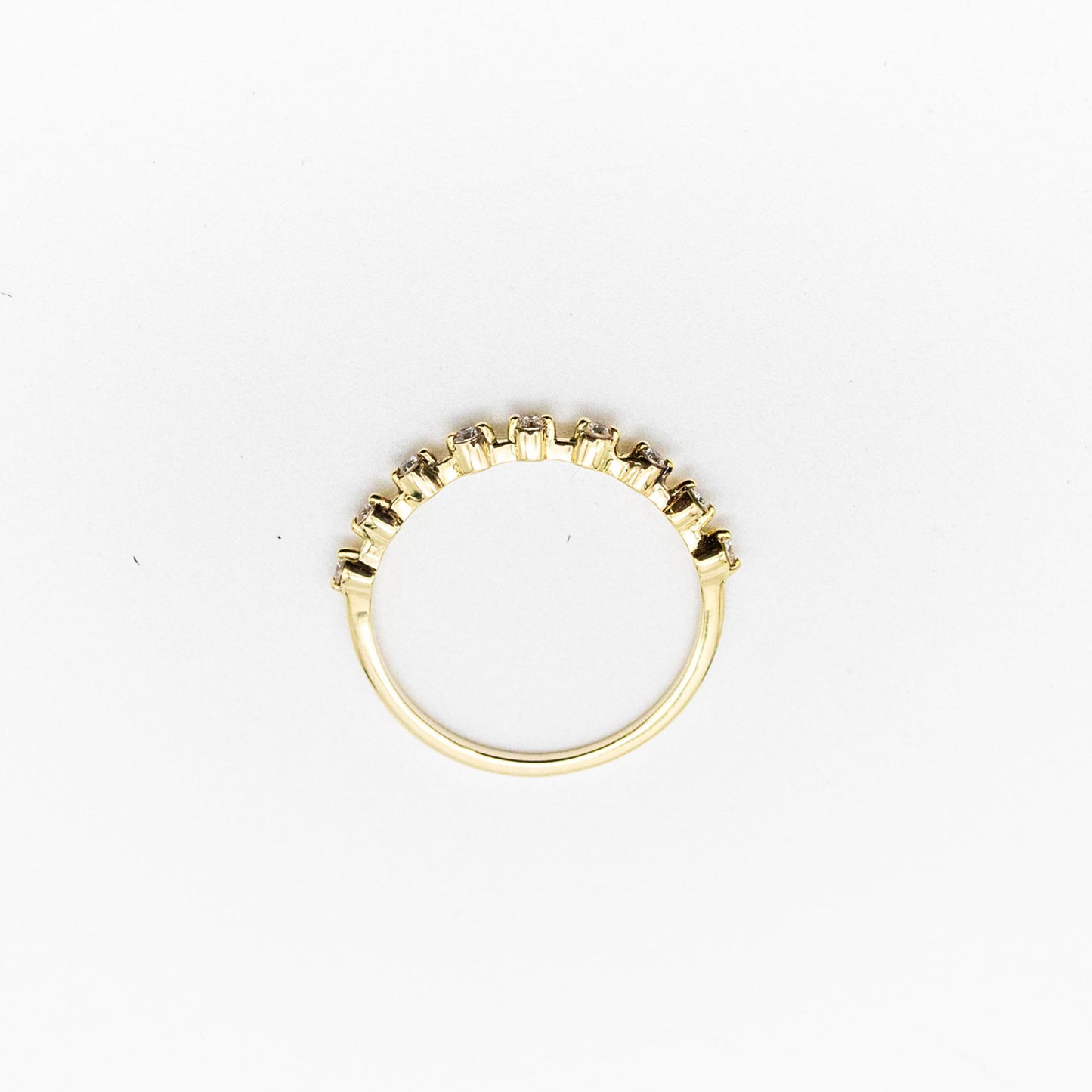 Spotted stacker ring with nine white diamonds on a thin 9ct gold band