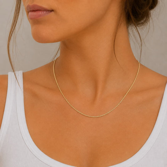 1.1mm Franco chain necklace in 9ct solid yellow gold worn around the neck