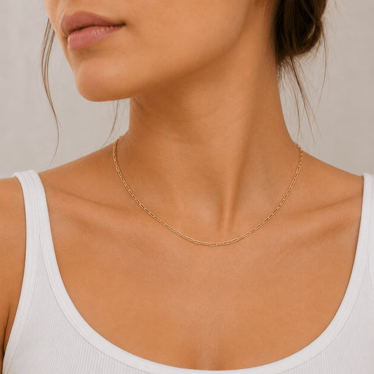 2.3mm paperclip chain in 9ct yellow gold worn around the neck