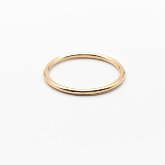 Minimalist 9ct solid gold stacker ring with a smooth polished band and 1.3mm thickness.