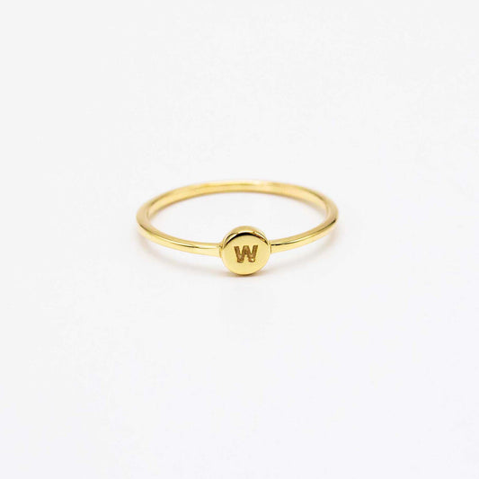 9ct solid gold signet stacker ring featuring a small round initial disc, shown with the letter W.
