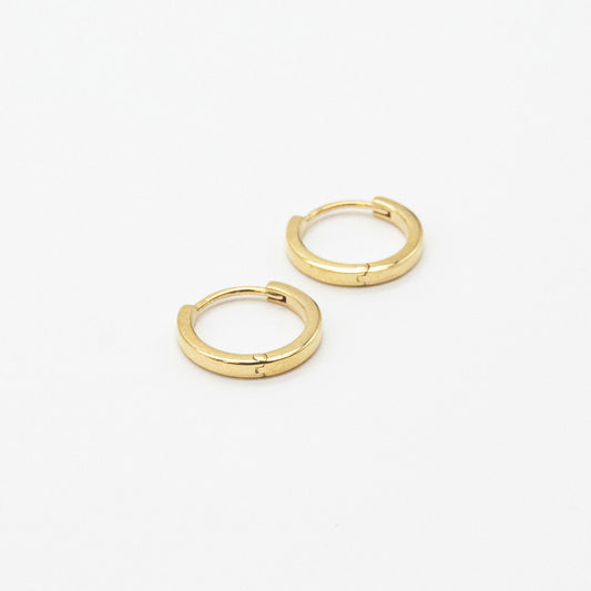 Bold mini gold hoop earrings from Leesha Fine Jewellery on a white background.
