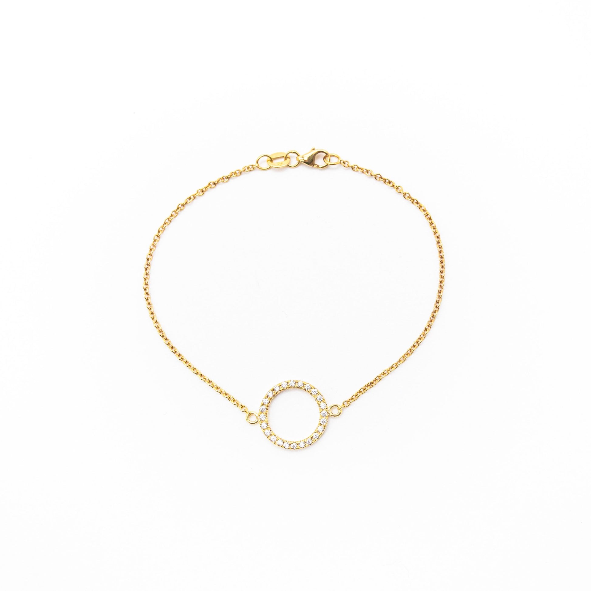 Elegant solid gold circle bracelet with 24 sparkling white diamonds, handmade by Leesha Fine Jewellery