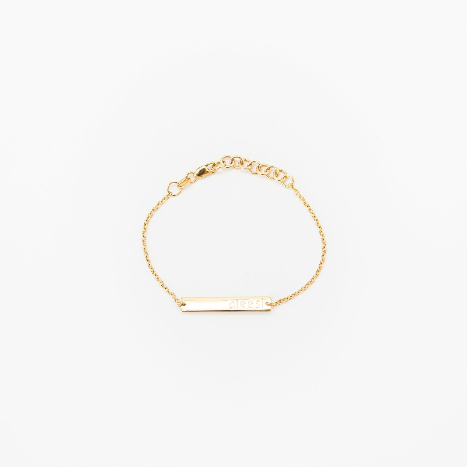 Personalised kids gold bracelet featuring custom engraved name plate, handcrafted by Leesha Fine Jewellery