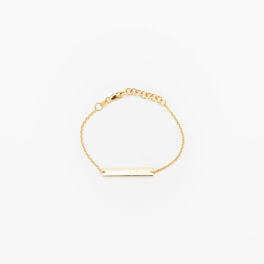 Personalised kids gold bracelet featuring custom engraved name plate, handcrafted by Leesha Fine Jewellery