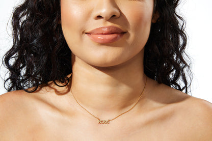 Model wearing name necklace 