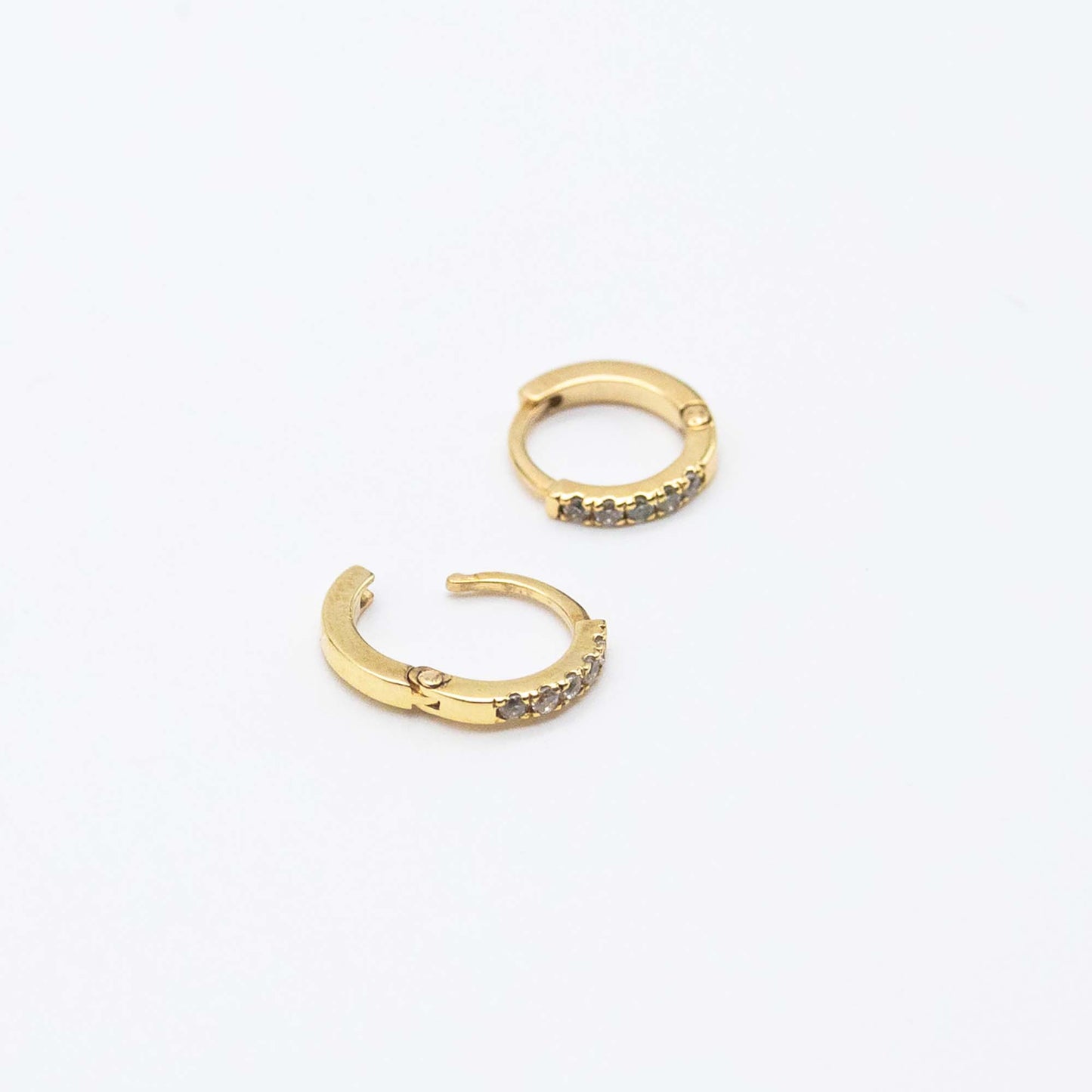 Pair of Mini Diamond Huggies 10mm in 9ct gold displayed on a white background