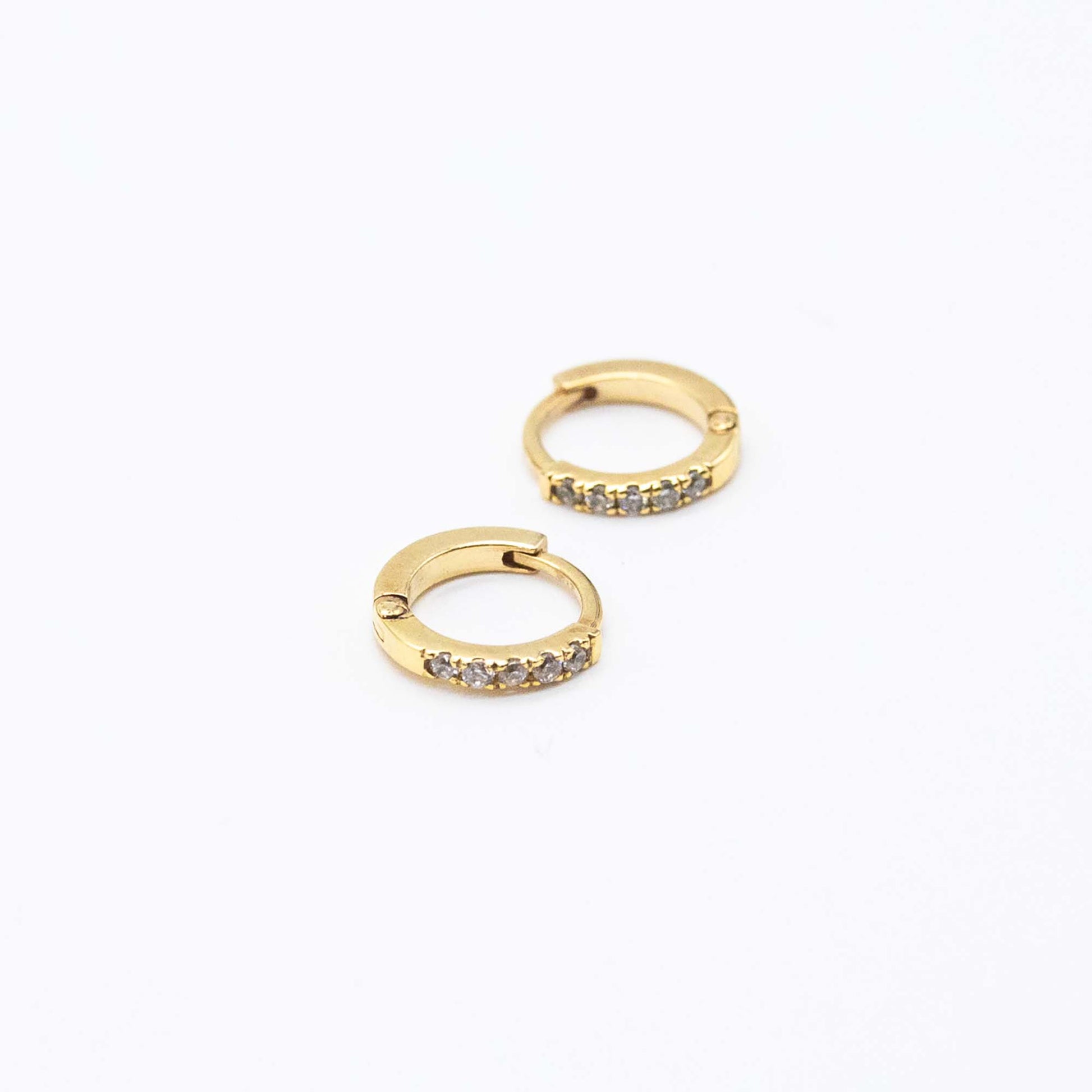 Pair of Mini Diamond Huggies 10mm in 9ct gold displayed on a white background