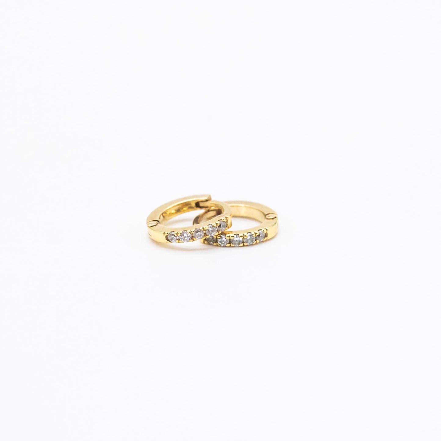 Pair of Mini Diamond Huggies 10mm in 9ct gold displayed on a white background