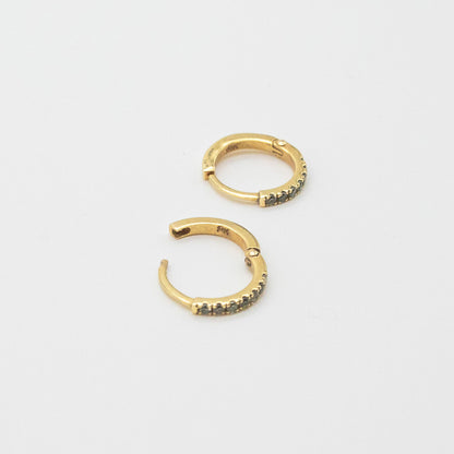 Mini Diamond Huggies 12mm displayed on a white background, showcasing seven round diamonds set in 9ct gold.