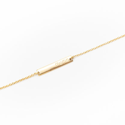 Personalised gold bracelet with sleek name plate design, handcrafted by Leesha Fine Jewellery