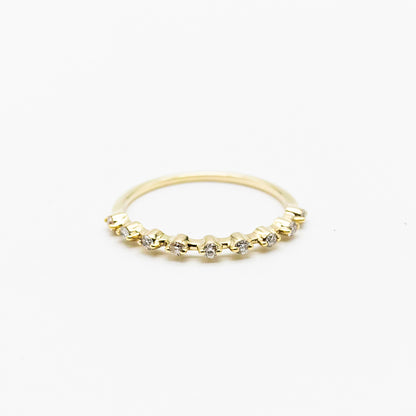 Spotted stacker ring with nine white diamonds on a thin 9ct gold band