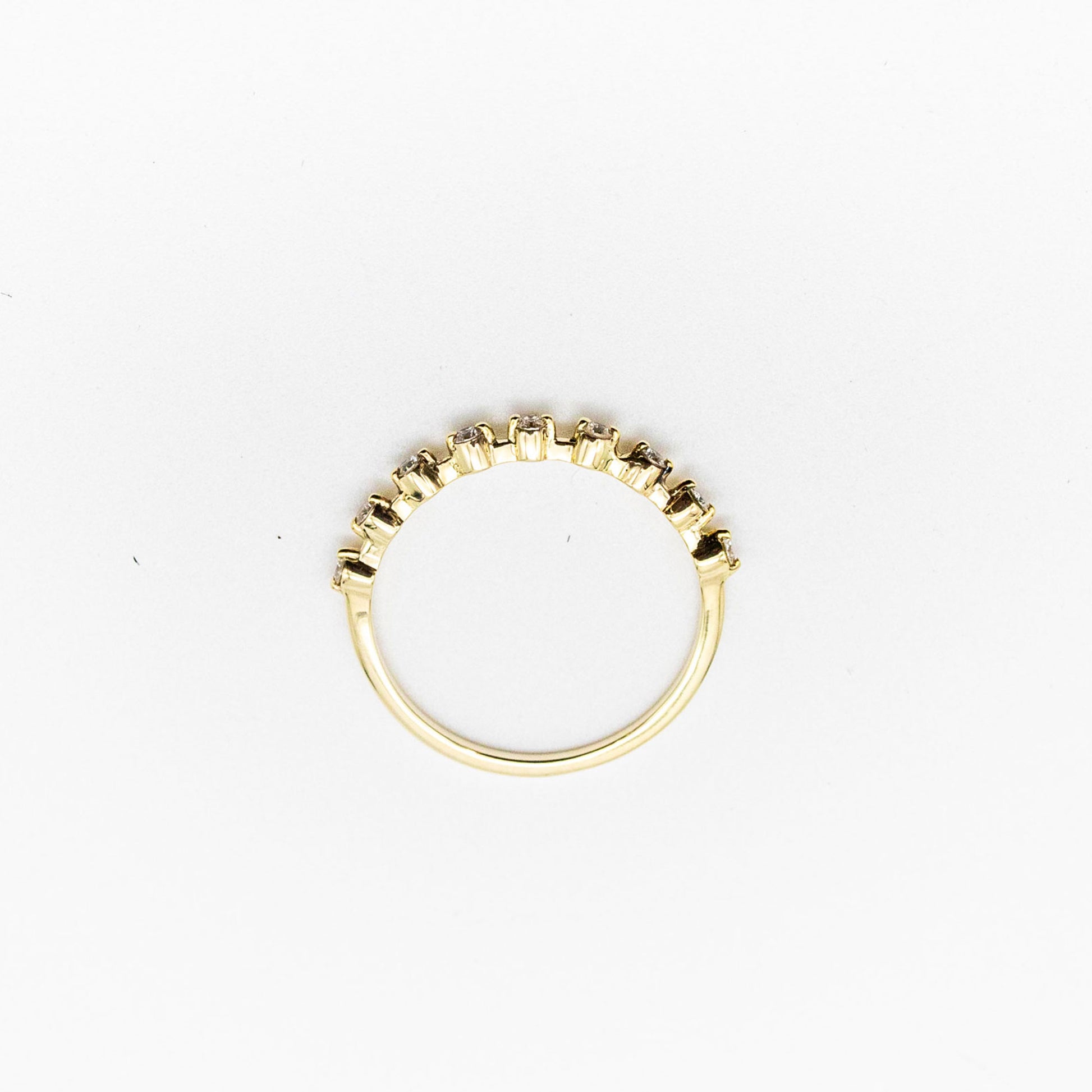 Spotted stacker ring with nine white diamonds on a thin 9ct gold band