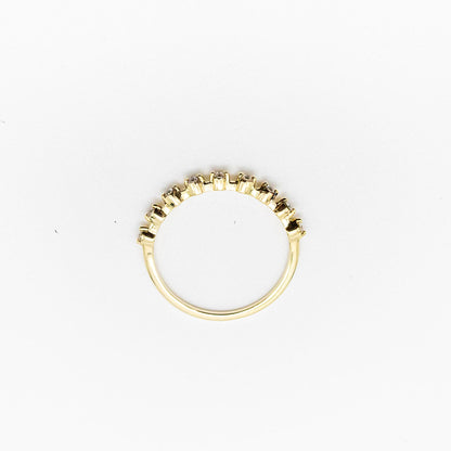 Spotted stacker ring with nine white diamonds on a thin 9ct gold band