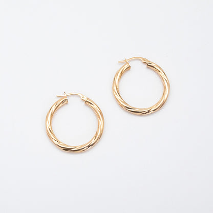 Textured 9ct gold hoop earrings featuring a 2mm twisted tube design.