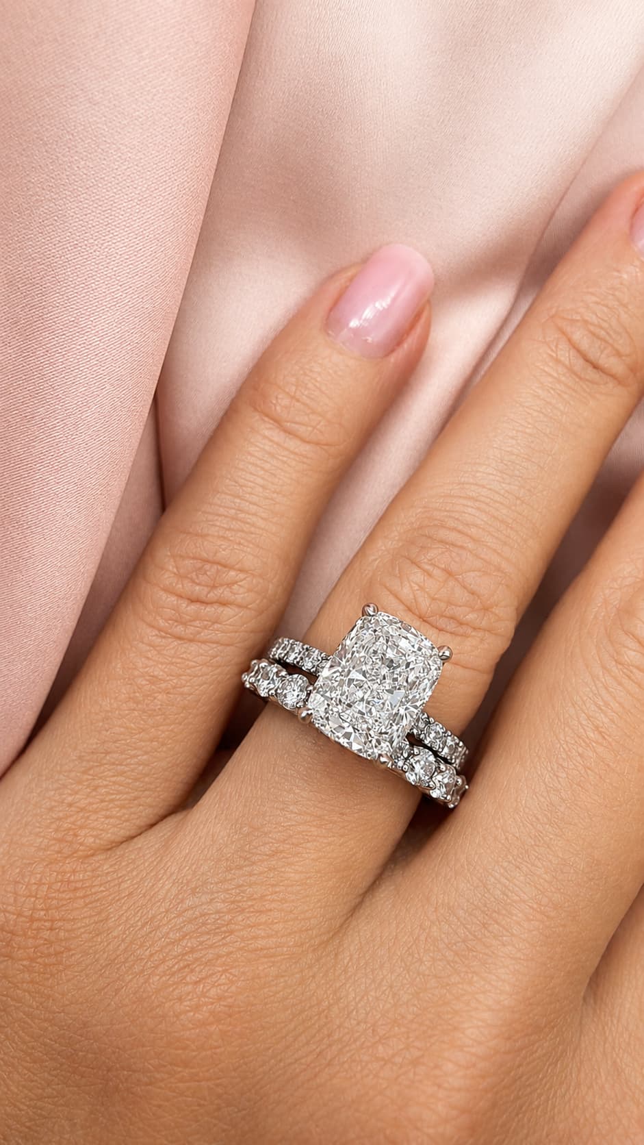 Cushion cut diamond engagement ring with diamond wedding band in platinum