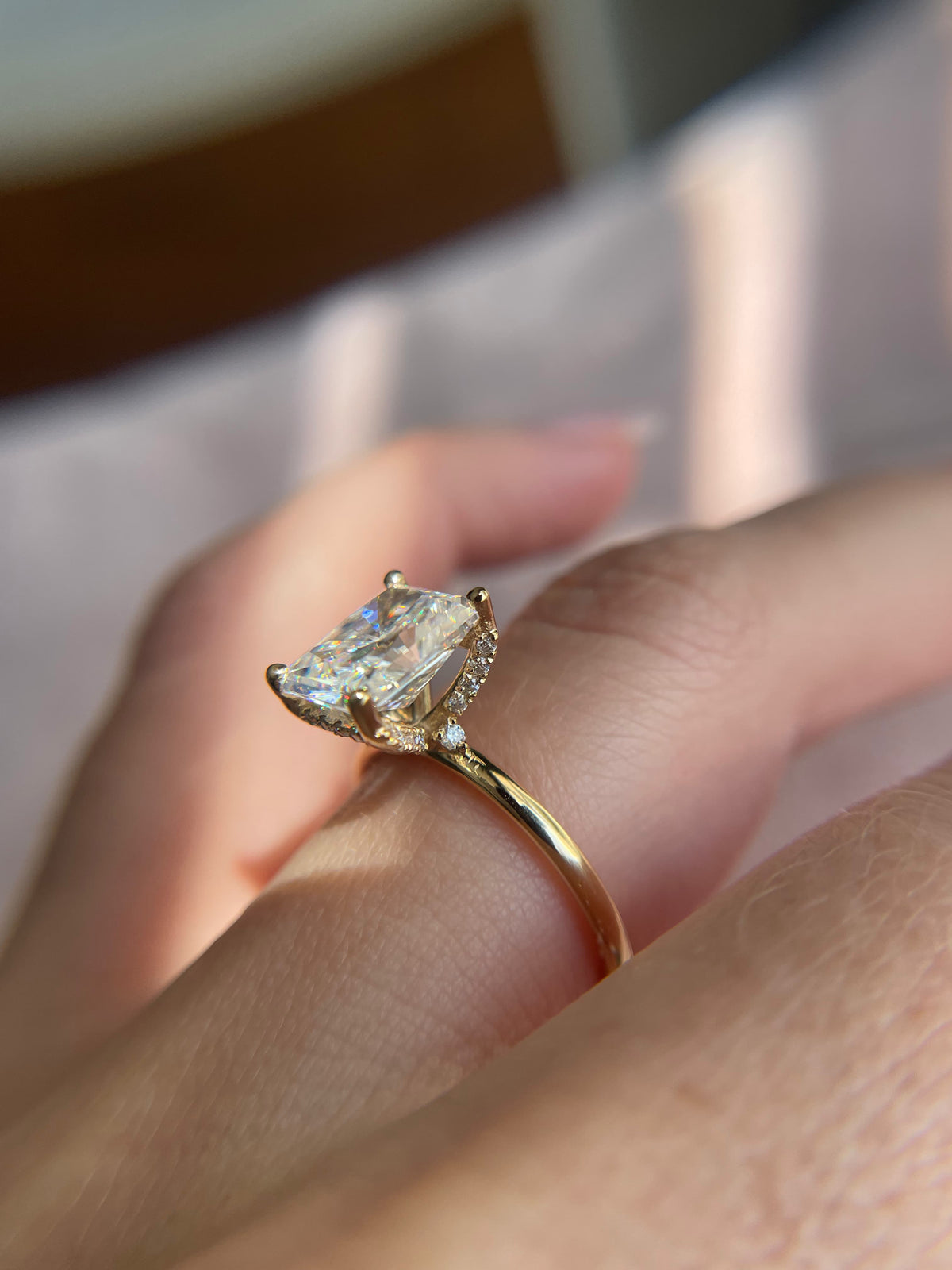 Elongated cushion cut diamond engagement ring in yellow gold