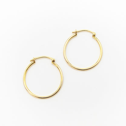 Side-by-side view of medium 9ct gold hoop earrings