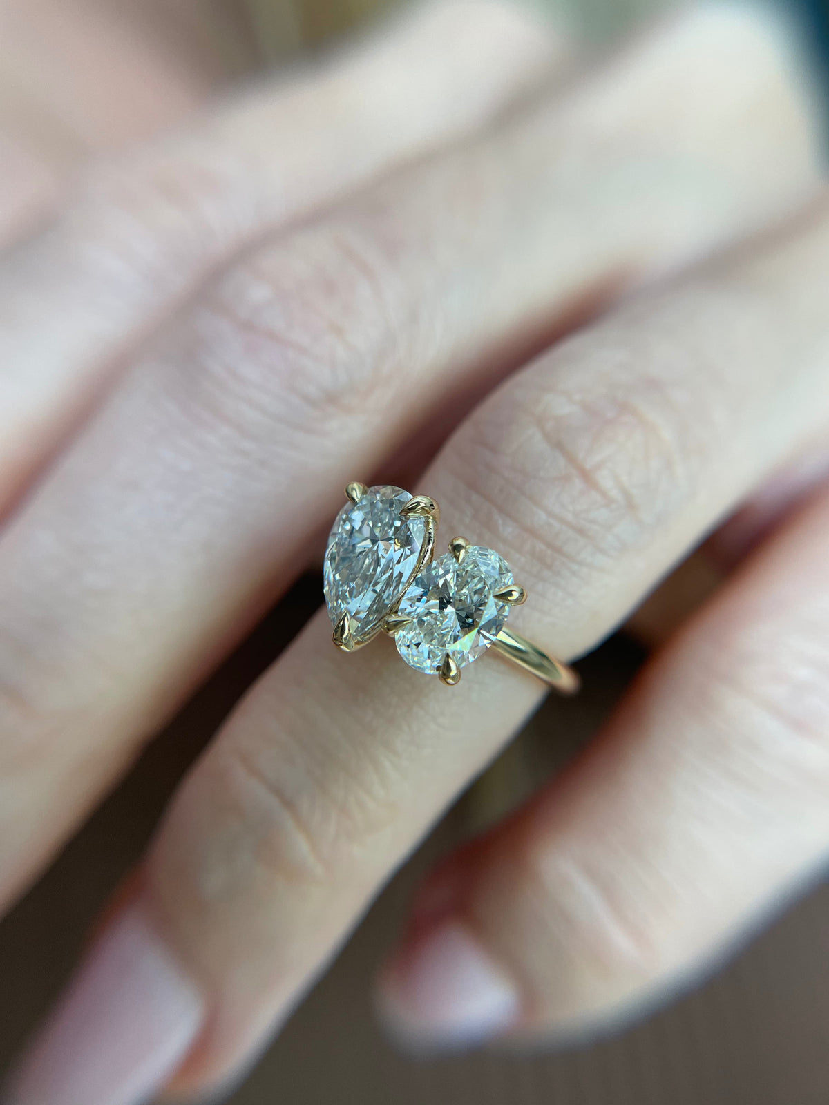 Pear and oval diamond toi et moi ring in 9ct yellow gold