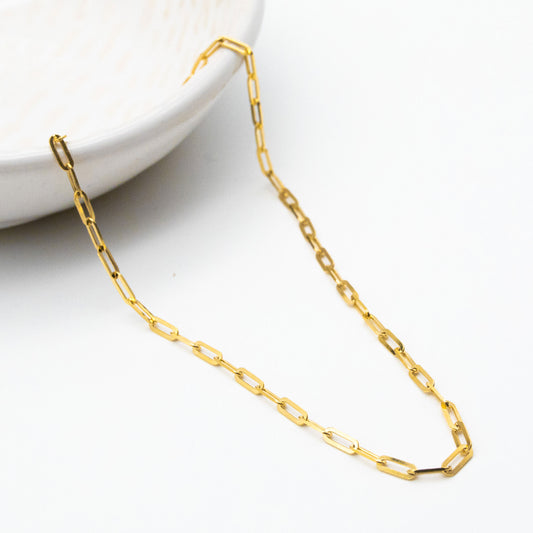 2.3mm paperclip chain in 9ct yellow gold worn around the neck